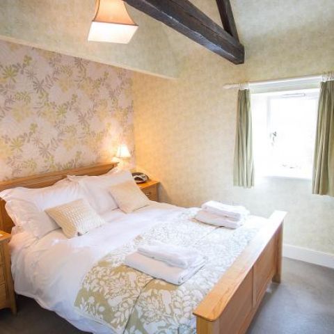 Double en suite bedroom. South facing with view of garden & woods