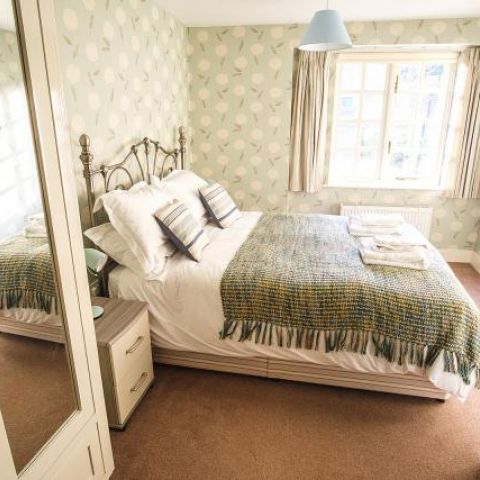 King size bedroom on lower ground floor, adjacent shower room & separate loo