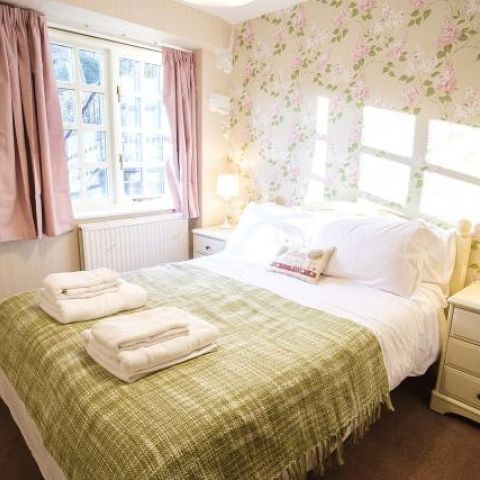 Double bedroom on lower ground floor, adjacent to shower room & separate loo