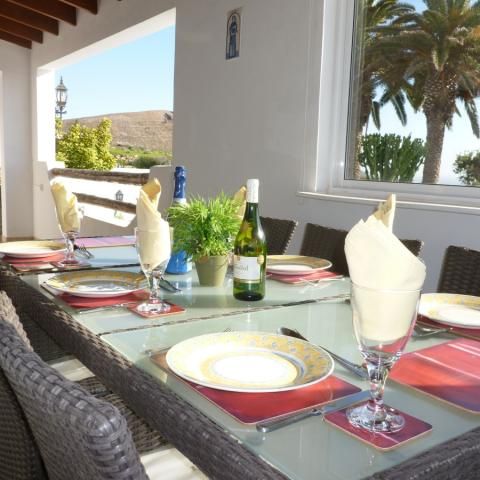 Dining on the covered terrace at Villa Antonio