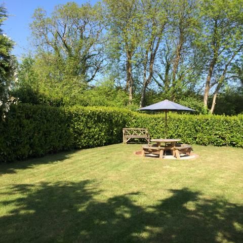 The Corn Barn's front garden catching the evening sunshine.