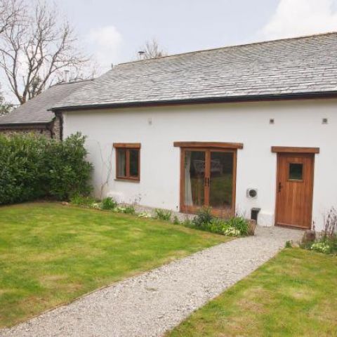 The front of the Threshing Barn with it's private front garden.