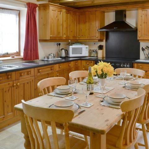 well equipped farmhouse kitchen with electric range, dishwasher etc