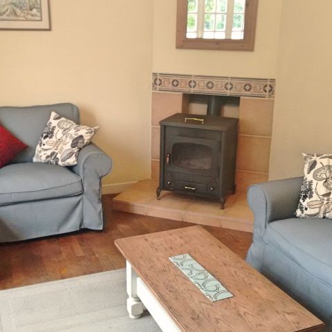 La Belle Maison, cosy sitting room with woodburner