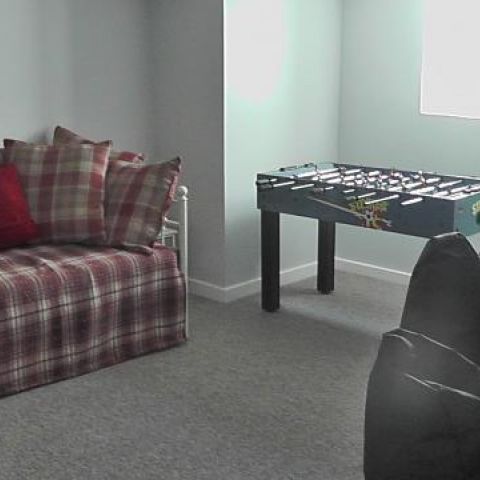 games room with football table & xbox. can be used as lower ground floor bedroom