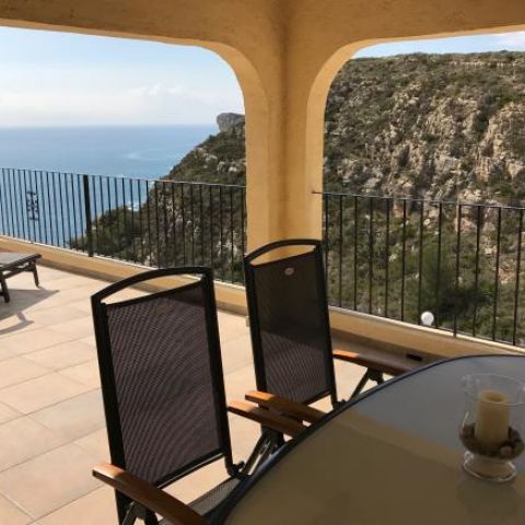 Outdoor dining table on the terrace with sea views